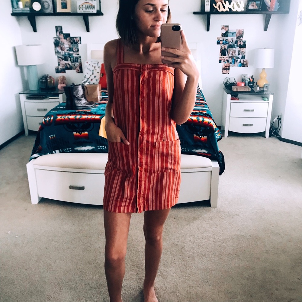 Burnt orange Button up dress.